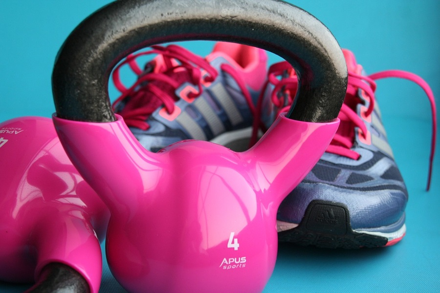 Transform 20 Week 3 Workouts and Tips Close Up of a Pink Kettlebell in Front of Running Shoes