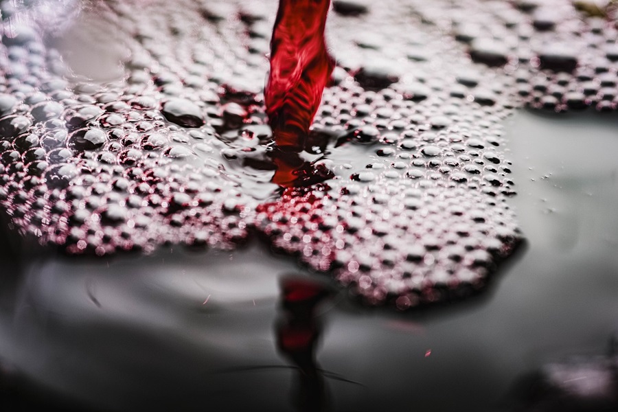 Warm Wine Recipe Spices Close Up of Red Wine Being Poured 