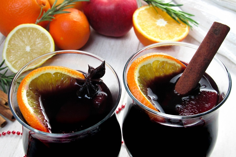 Warm Wine Recipe Spices Two Glasses of Mulled Wine with Fruit Nearby