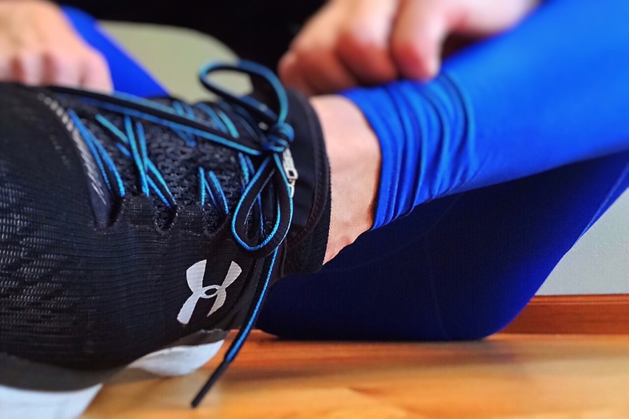 21 Reasons to Try 21 Day Fix Workouts Close Up of a Running Shoe Being Tied by a Person
