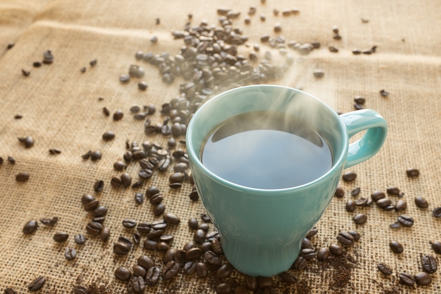 Intermittent Fasting Coffee Recipes a Blue Cup of Coffee Surrounded by Coffee Beans