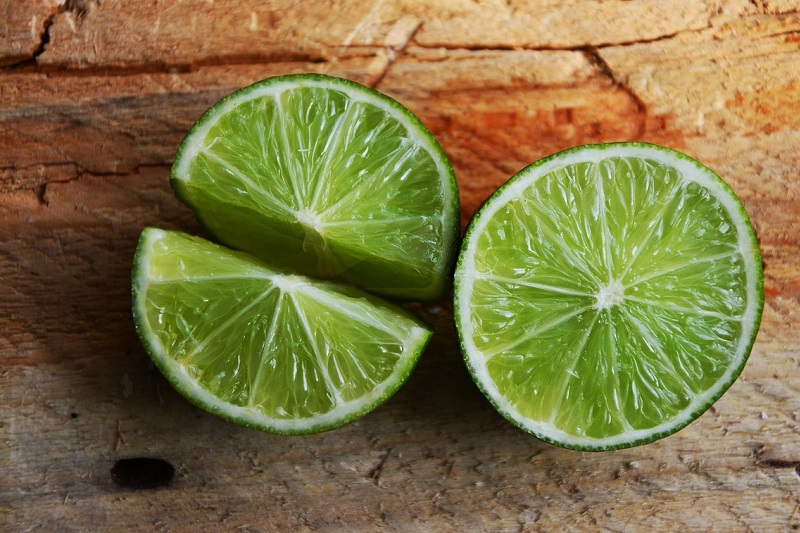 Minute Maid Limeade Margarita Recipes Close Up of a Lime Cut in Half and One Half Cut into Halves Again