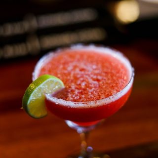 DIY Margarita Glasses Close Up of a Margarita with a Lime on the Edge of the Glass