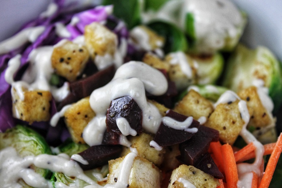 Low Carb Buddha Bowl Recipes Close Up of a Buddha Bowl with Croutons and Dressing