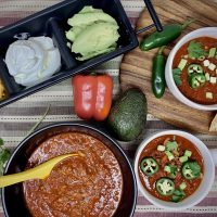2B Mindset Instant Pot Chili Recipe Overhead View of Three Bowls of Chili with a Serving Tray of Other Toppings