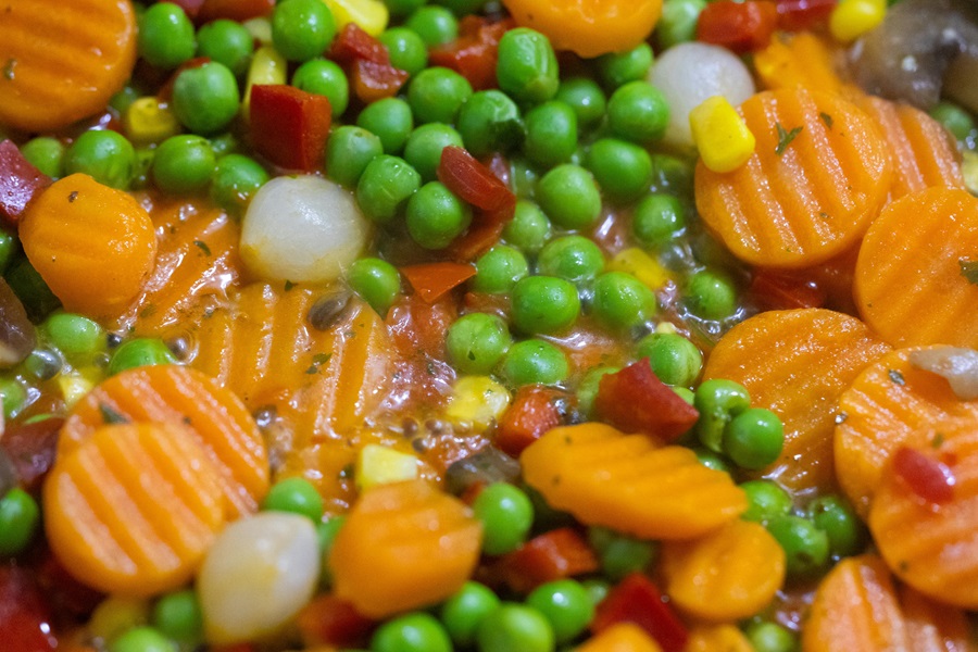 Vegetarian Crockpot Freezer Meals Close Up of Sliced Carrots with Peas and Onions in a Stew