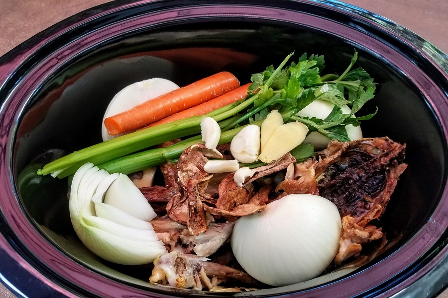 Bone Broth While Intermittent Fasting a Crockpot Filled with Veggies and Bones
