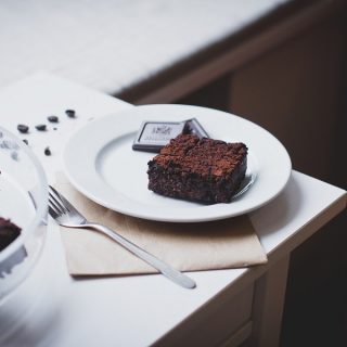 Keto Brownie Recipes A White Plate on a Table with a Brownie on it