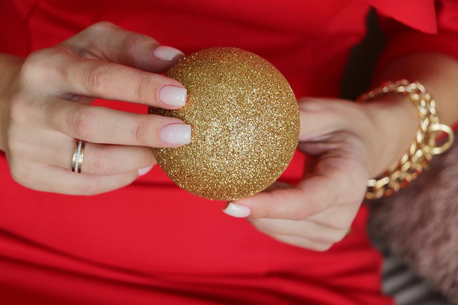 Low-Carb Holiday Recipes Close Up of a Golden Ornament in Two Hands