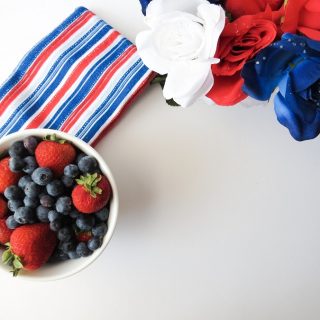 Red White and Blue Margarita Recipes a Bowl of Berries with a Bouquet of Red White and Blue Flowers and a Towel with Red White and Blue Stripes