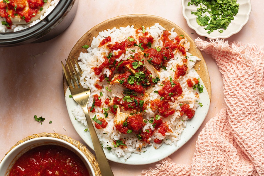 Salsa Chicken and Rice Recipe a Plate of Salsa Chicken with Rice Next to Plates of Cilantro and Salsa