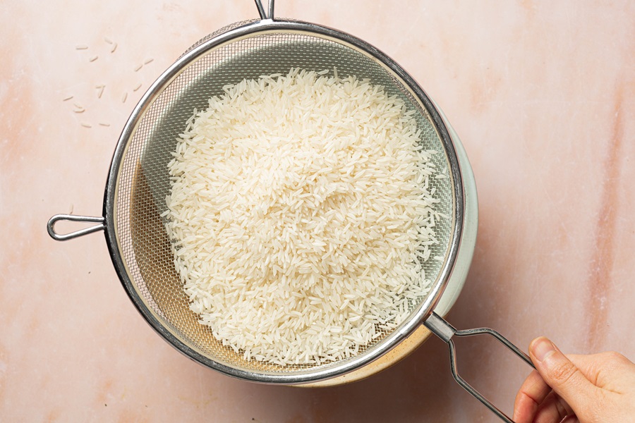 Salsa Chicken and Rice Recipe Close Up of White Rice in a Strainer