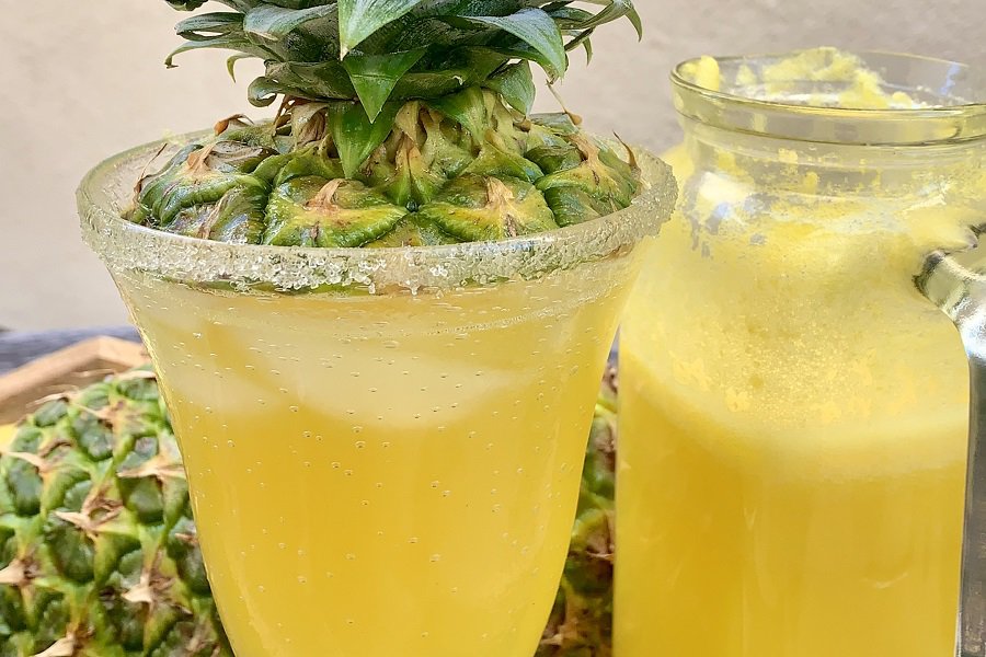 Fresh Pineapple Margarita Recipe without Triple Sec Close Up of a Pineapple Margarita Topped with the Top of a Pineapple