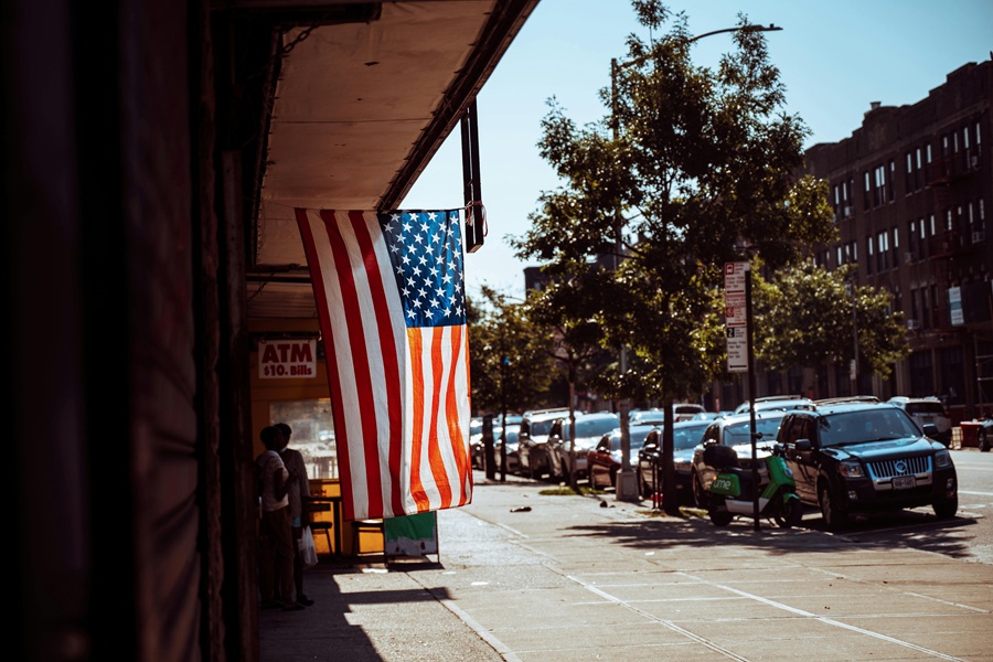 Red White and Blue Margarita Recipes View of an American Flag Hanging from a Small Business