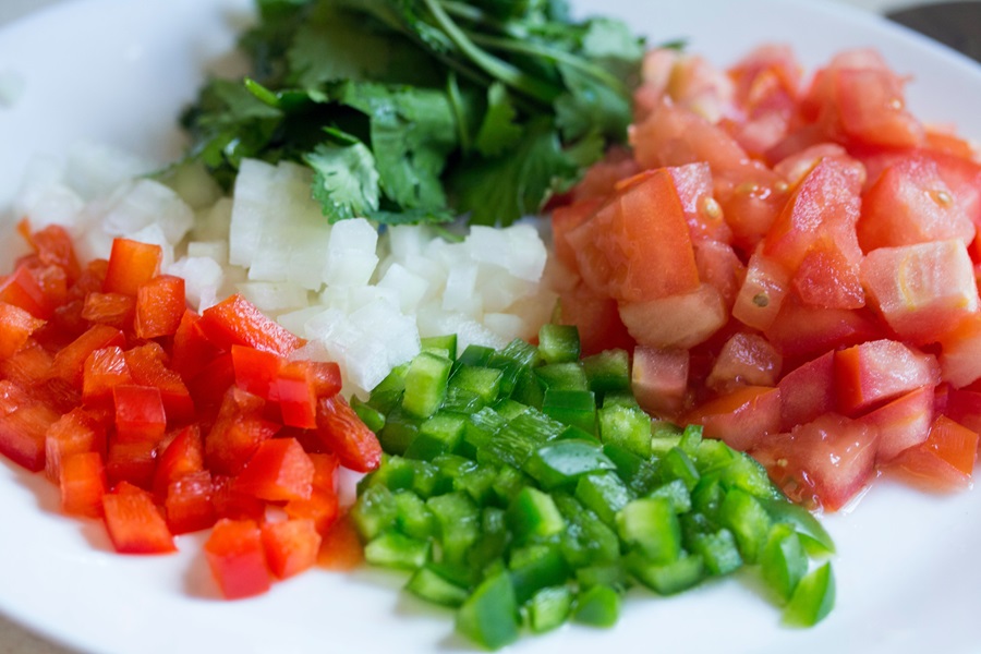 Beachbody 2B Mindset FAQ Close Up of Diced Tomatoes, Onions, Peppers, and Cilantro
