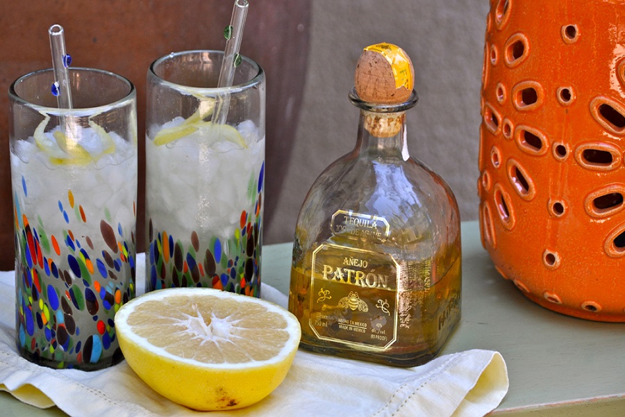 Best Boating Drinks Close Up of Two Cocktail Glasses Next to a Bottle of Patron and a Half a Lime