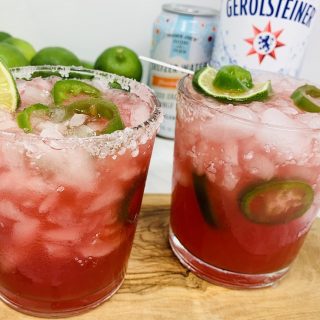 Spicy Margarita Recipe Two Glasses of Margarita with Ingredients Behind Them