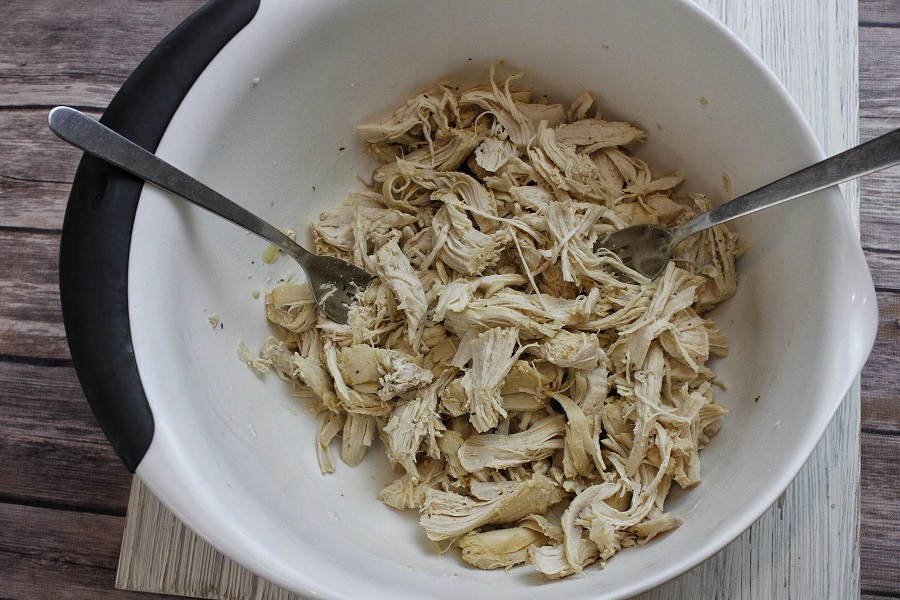 Low Carb Crockpot Chicken and Veggies Soup Chicken Shredded in a Bowl