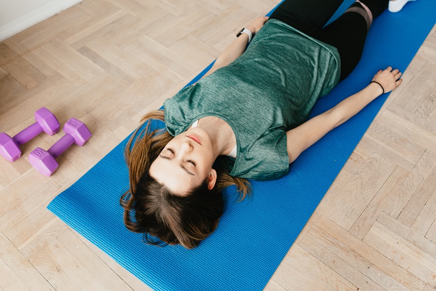 Jillian Michaels Banish Fat Boost Metabolism a Woman Laying on a Yoga Mat in a Room