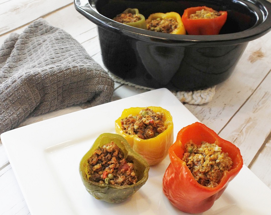 Low Carb Crock Pot Stuffed Peppers On a Plate in Front of a Crockpot