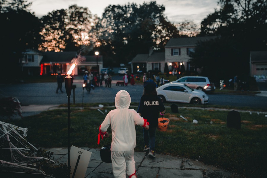 Downloads for your Halloween Playlist View of a Community of Kids Trick or Treating on Halloween