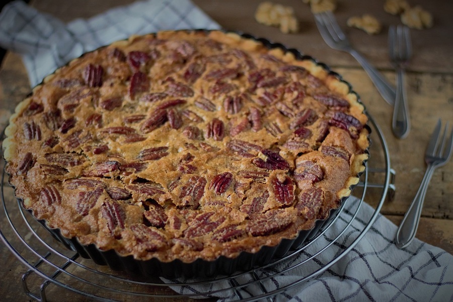 Easy Crockpot Thanksgiving Desserts a Fresh Pecan Pie on a Towel