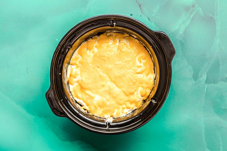 Slow Cooker John Wayne Casserole View of the Melted Cheese Layer in a Crockpot