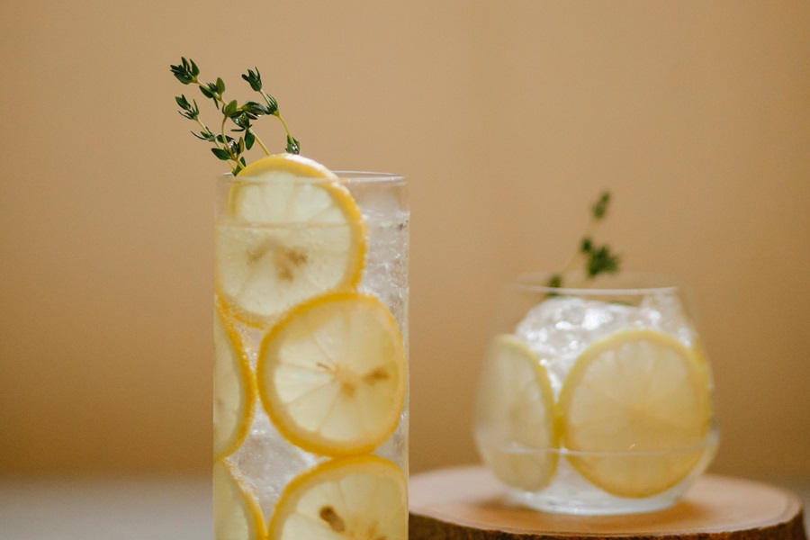 Easy Jillian Michaels Detox Tips Close Up of a Glass of Water with Lemon Slices and Rosemary Inside