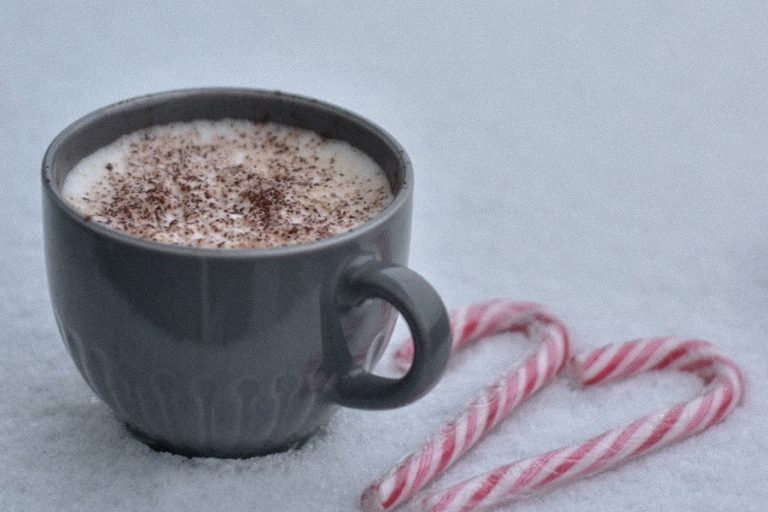Spiked Hot Chocolate Recipes a Cup of Hot Chocolate in the Snow with Candy Canes Next to it