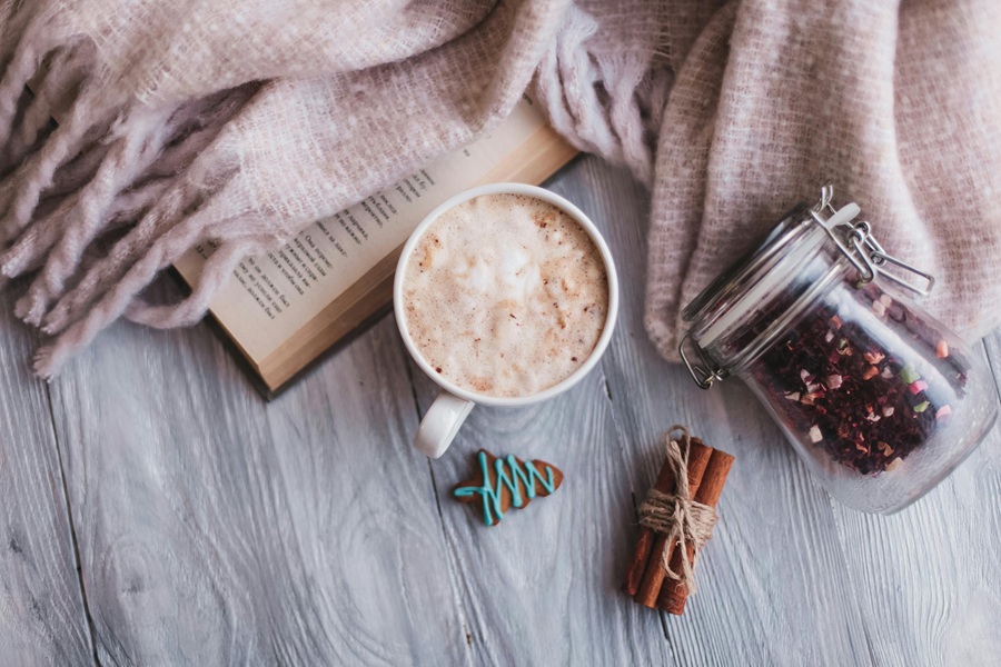 Spiked Hot Chocolate Recipes a Cup of Hot Chocolate on a Wooden Surface Next to a Small Christmas Tree Cookie and a Cozy Blanket