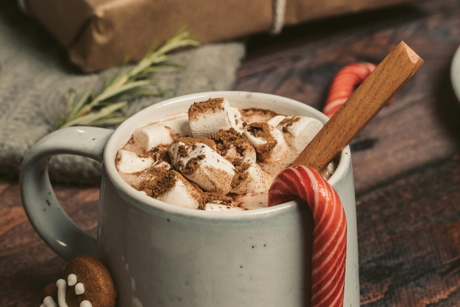 Spiked Hot Chocolate Recipes a Cup of Hot Chocolate with a Candy Cane Sticking Out From the Coco 