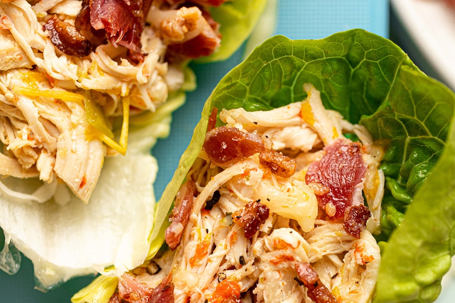 Crockpot Chicken and Bacon Keto Close Up of a Single Lettuce Wrap on a Blue Platter