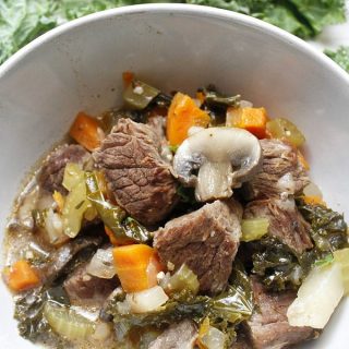 Instant Pot Low Carb Beef Stew Kale with a Bowl of Stew On Top of it
