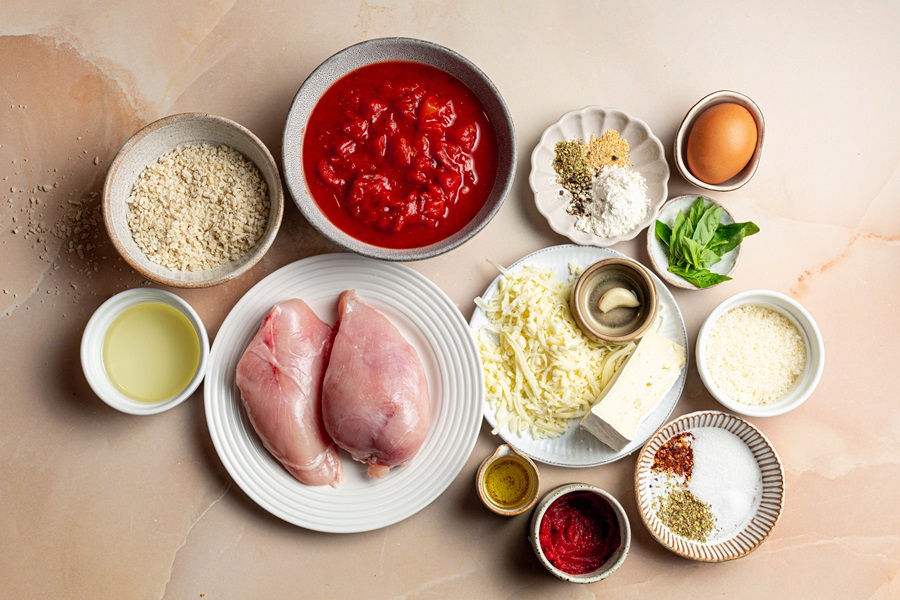 Best Panko Chicken Parmesan Recipe Overhead View of Ingredients Separated into Small Bowls and Plates