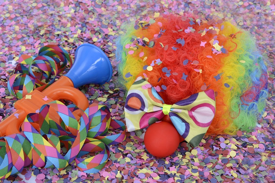 5 April Fools Jokes for Young Kids a Clown Wig, Nose and Bow Tie on Colorful Confetti
