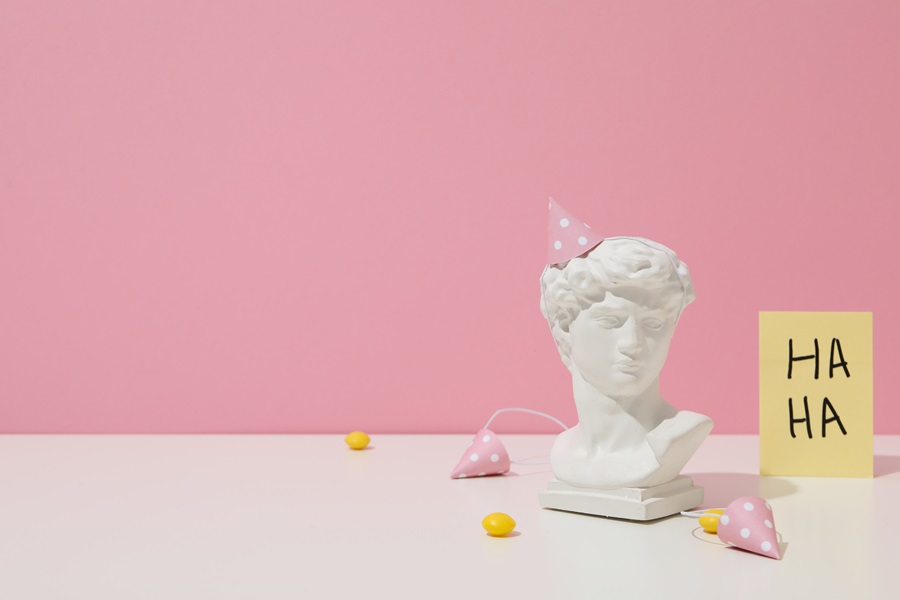 7 April Fools Prank Ideas for Friends a Statue Bust with a Pink Party Hat On 