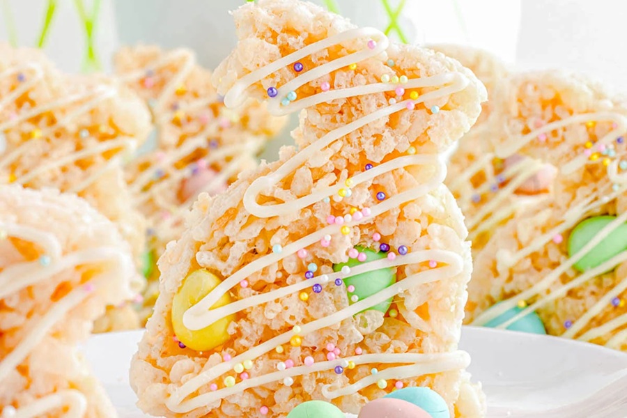 Rice Krispies Treats for Easter Rice Krispies Treats Shaped Like Bunnies Drizzled with Icing and Candy Eggs Inside Each