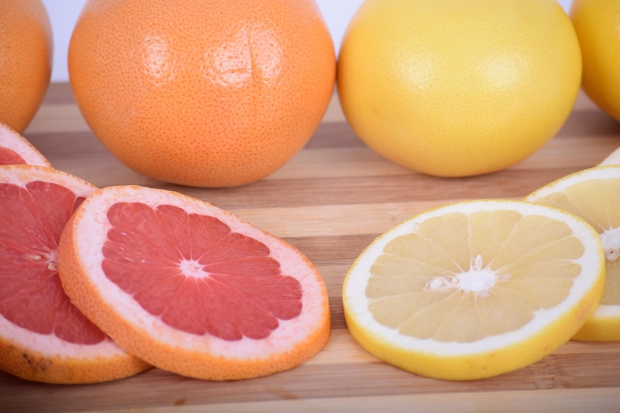 Colorful Margaritas for Spring Close Up of a Grapefruit and a Lemon With Grapefruit and Lemon Slices in Front of Each