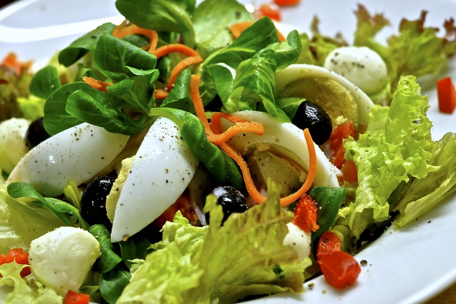 Red Wine Vinegar Salad Dressing Recipes Close Up of a Basic Salad with Hard Boiled Eggs, Lettuce, Carrots, Olives, and Tomatoes