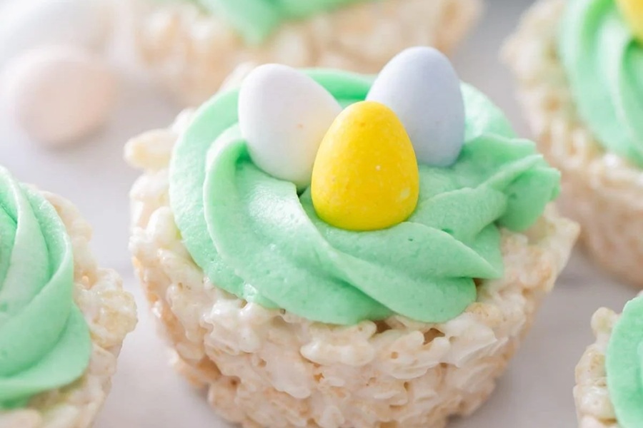Rice Krispies Treats for Easter Close Up of Rice Krispies Treats Shaped Like Baskets with Icing on Top and Three Candy Eggs