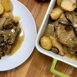 Crockpot Pork Chops and Gravy Recipe Overhead View of Pork Chops in a Serving Tray and One on a Plate