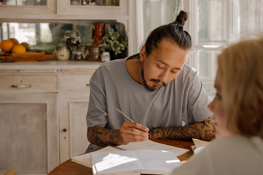 Amazon Echo Show a Man Studying at a Table