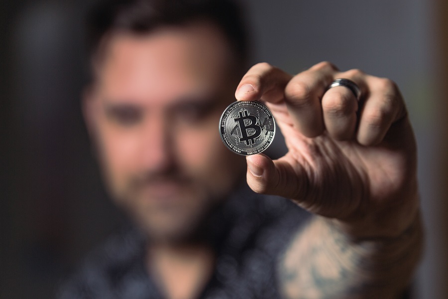 Amazon Echo Show a Man Holding Up a Bitcoin