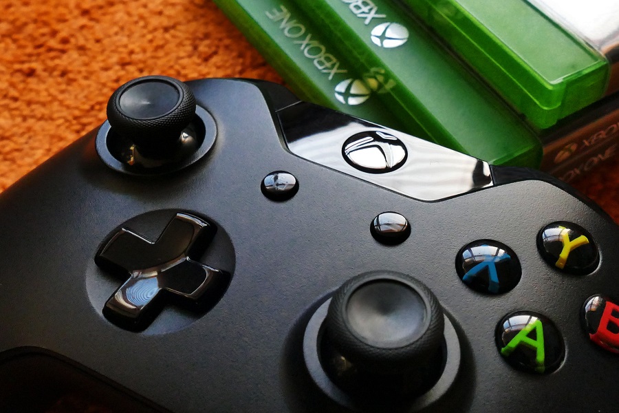 Amazon Echo Show Close Up of an Xbox Controller with Some Game Cases in the Background