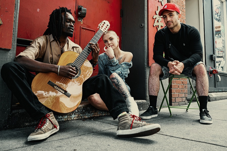 Amazon Echo Show a Band Sitting Outside of a Building Performing a Song