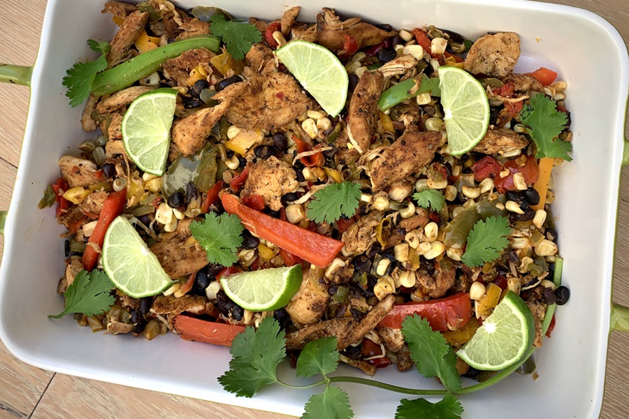 Dairy Free Slow Cooker Chicken Fajitas Recipe Close Up of a Serving Platter Filled with Chicken Fajitas Topped with Lime Wedges