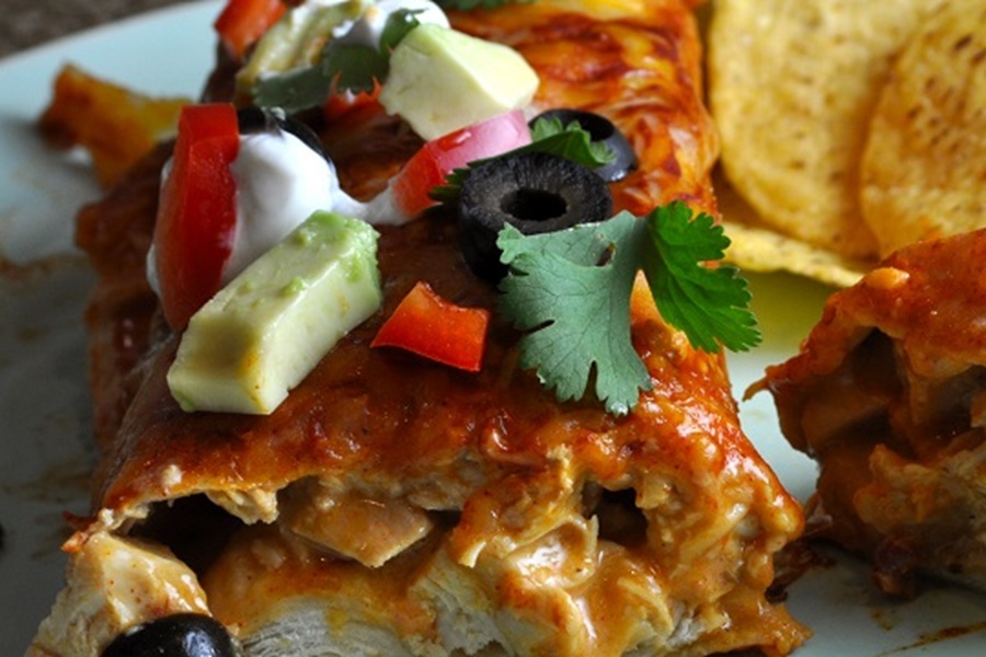 Easy Chicken Enchiladas Recipe Close Up of an Enchilada Cut in Half