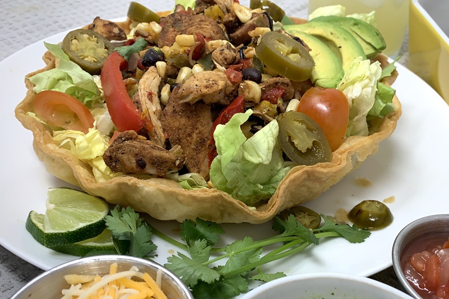 Dairy Free Slow Cooker Chicken Fajitas Recipe Chicken Fajitas in a Taco Shell Bowl with a Small Dish of Vegan Cheese