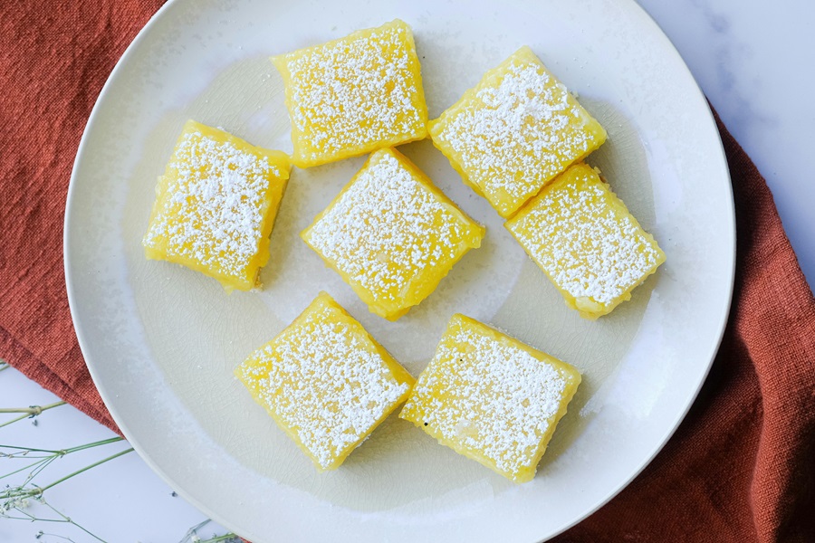 Delicious Dairy Free Desserts a Plate of Lemon Bars Sprinkled with Powdered Sugar