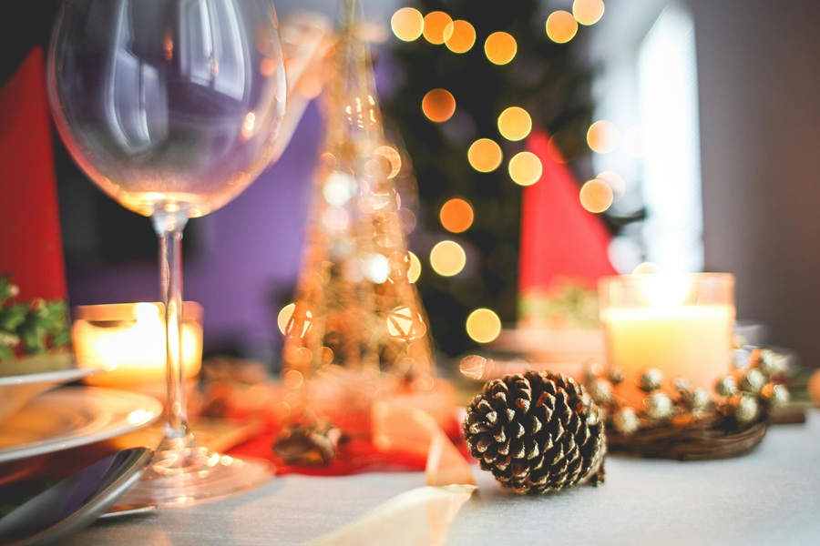 Cranberry Margarita Recipes a Table Set for a Holiday Party with Wine Glasses and Pine Cones